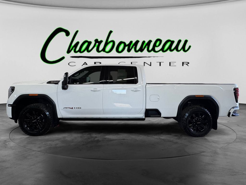 Used 2024 Summit White GMC 4WD Crew Cab Long Bed AT4 image 2
