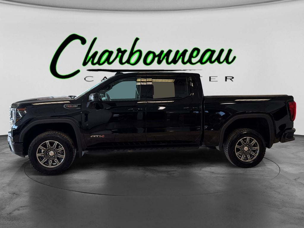 Used 2024 Onyx Black GMC 4WD Crew Cab Short Box AT4 image 2