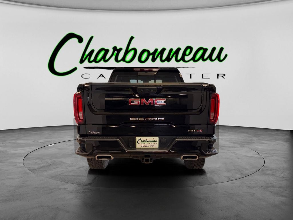 Used 2024 Onyx Black GMC 4WD Crew Cab Short Box AT4 image 4