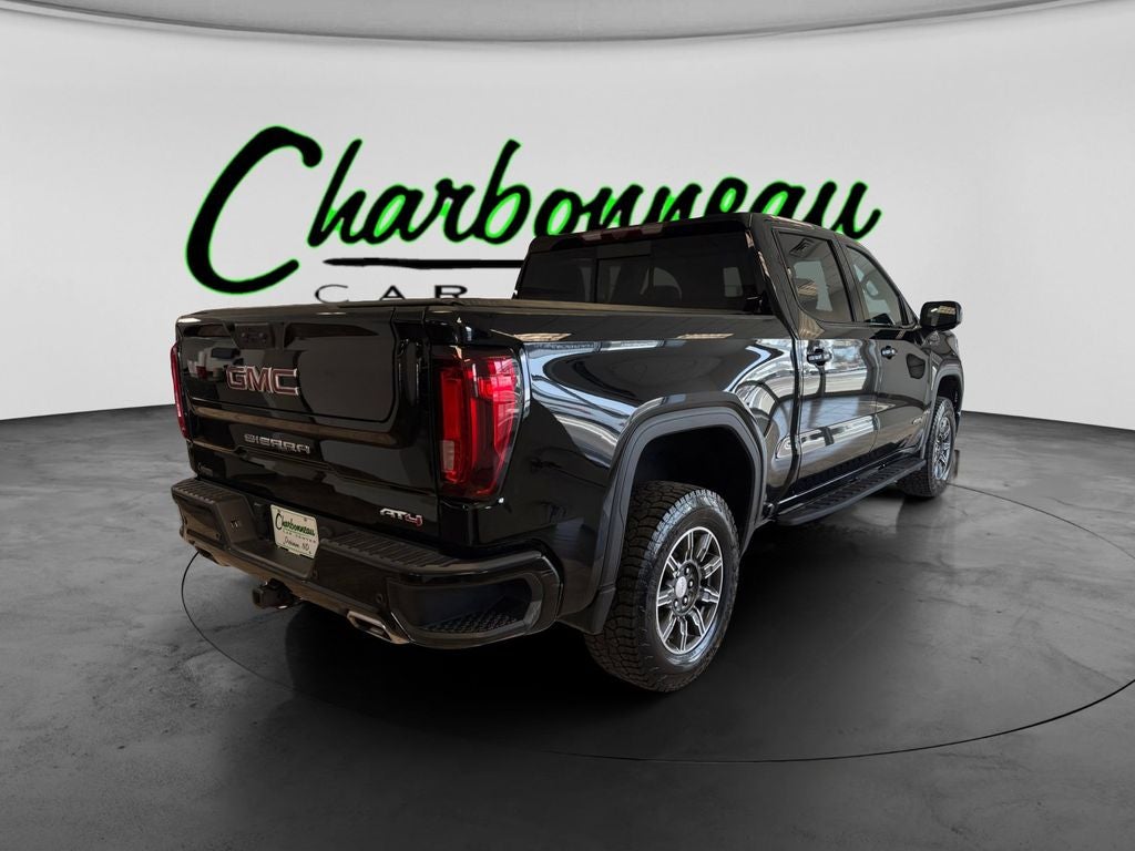 Used 2024 Onyx Black GMC 4WD Crew Cab Short Box AT4 image 5