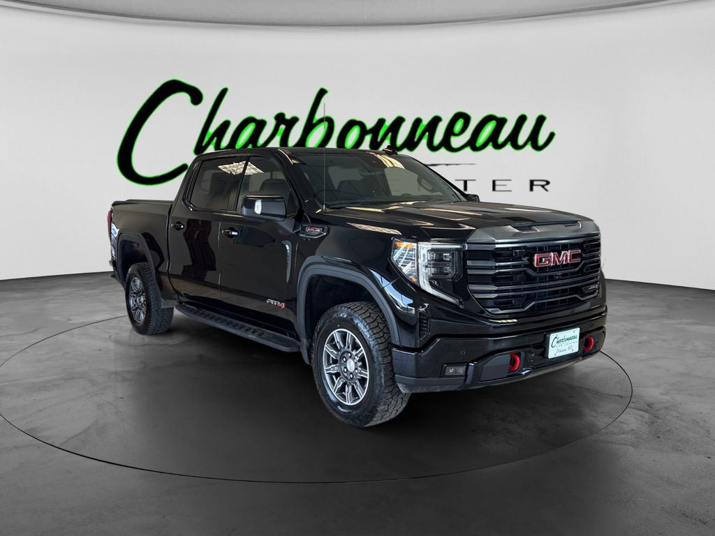 Used 2024 Onyx Black GMC 4WD Crew Cab Short Box AT4 image 7