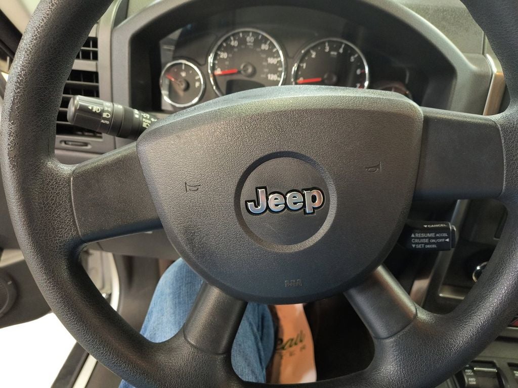 Used 2009 Bright Silver Metallic Clearcoat Jeep Sport image 13