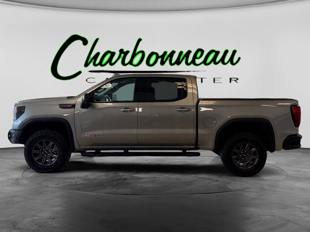 Used 2024 Sterling Metallic GMC 4WD Crew Cab Short Box AT4X image 2