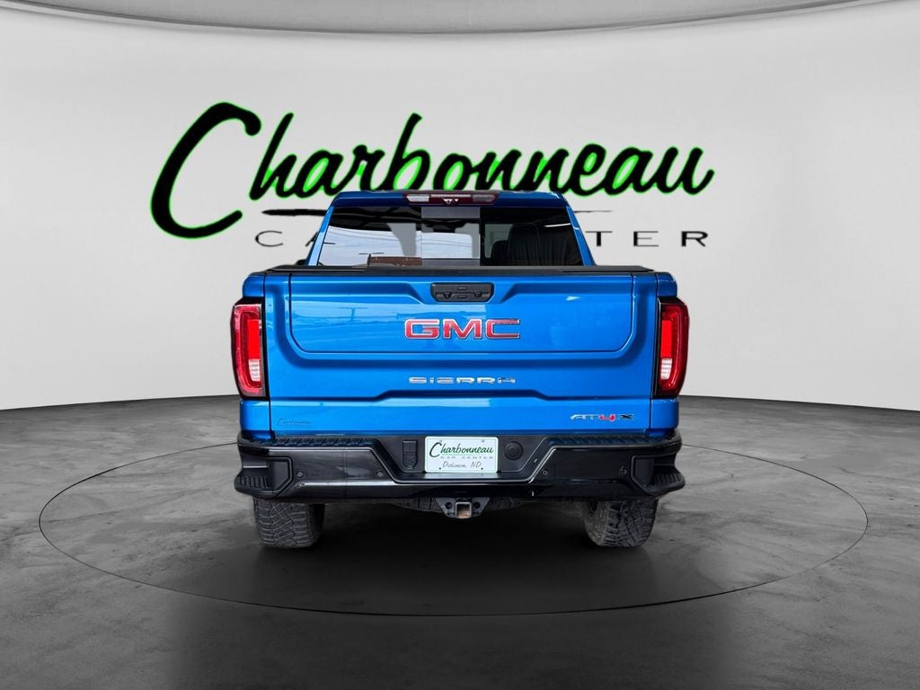 Used 2024 Dynamic Blue Metallic GMC 4WD Crew Cab Short Box AT4X image 4
