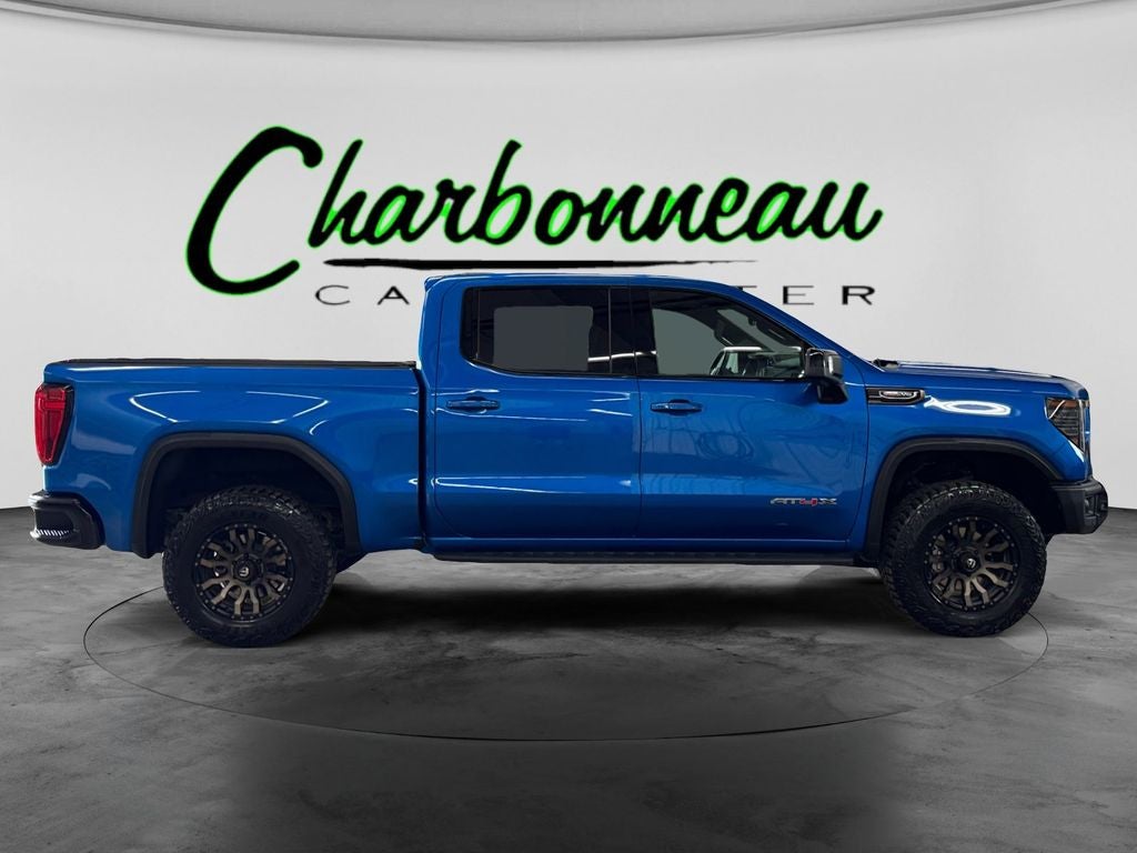 Used 2024 Dynamic Blue Metallic GMC 4WD Crew Cab Short Box AT4X image 6