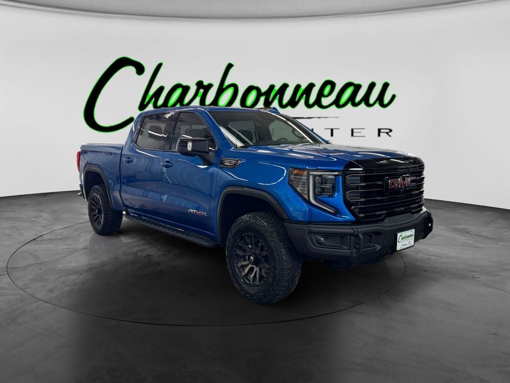 Used 2024 Dynamic Blue Metallic GMC 4WD Crew Cab Short Box AT4X image 7