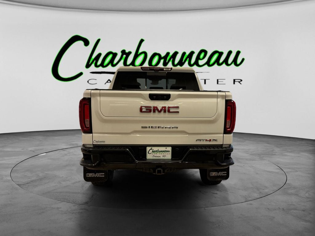 Used 2023 Summit White GMC 4WD Crew Cab Short Box AT4X image 4