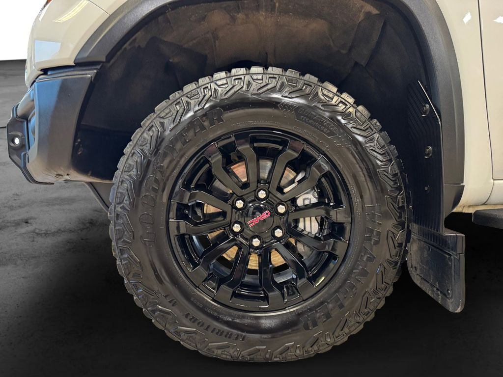 Used 2023 Summit White GMC 4WD Crew Cab Short Box AT4X image 9