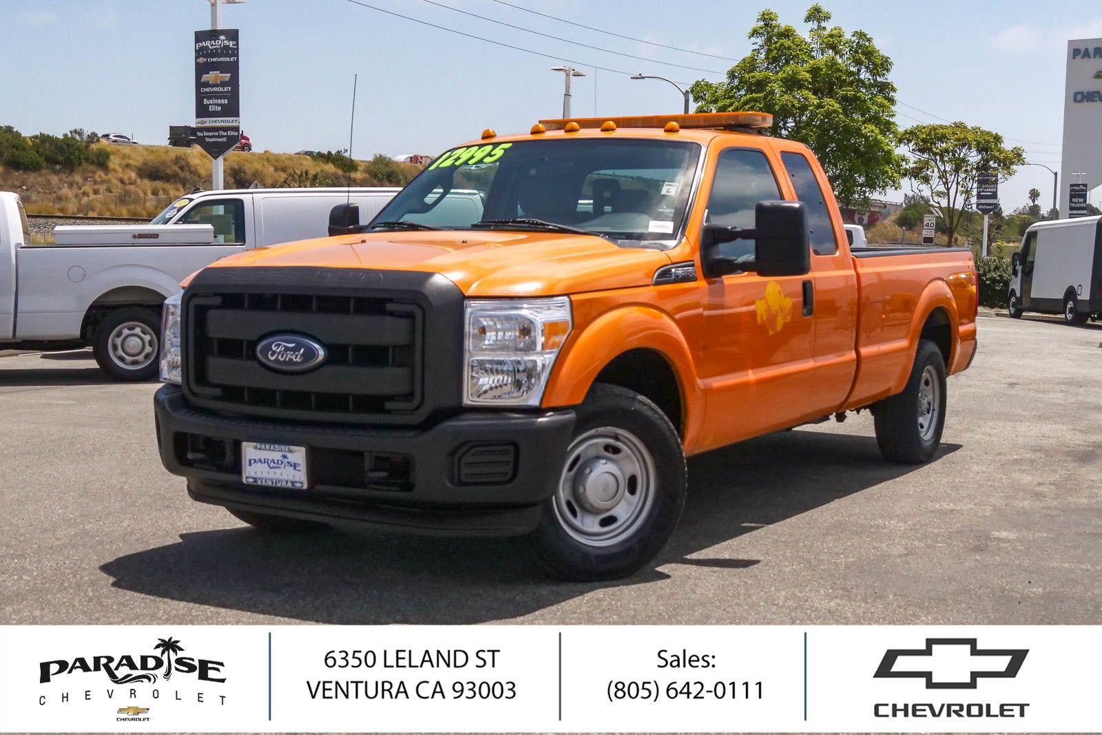 Orange 2015 Ford F-250 Super Duty Pickup Truck 4X2 6-Speed Automatic