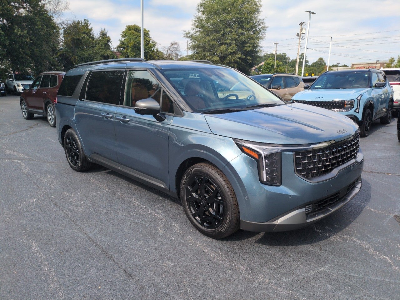 Blue 2027 Kia Carnival Minivan Front-Wheel Drive 