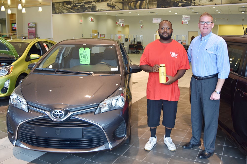 Manager of the Detail Department John Ruffin poses with Toyota General Manager Chuck Easters. Ruffin won Milton Ruben Superstore's Lose Baby Initiative by losing a total of 60 pounds in 90 days. For more information, visit http://bit.ly/1GCzaTx.