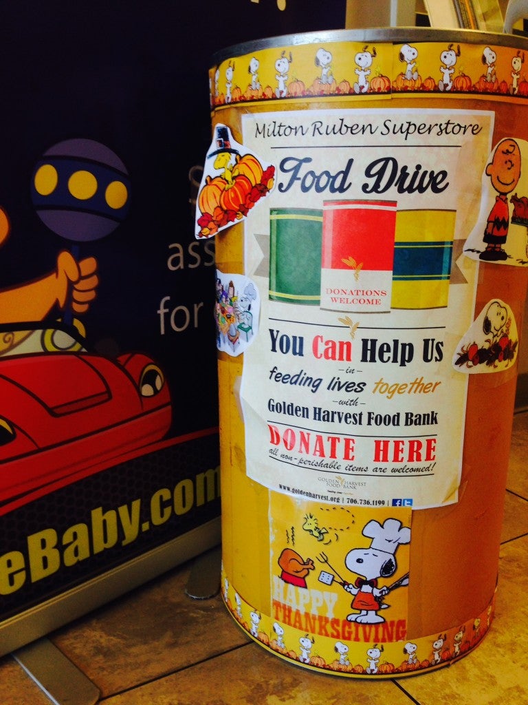 The Golden Harvest Food Bank Collection Bin next to the Chrysler Dodge Jeep Ram Cashier Counter.