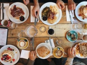 Plates of different breakfast meal at a restaurant. 