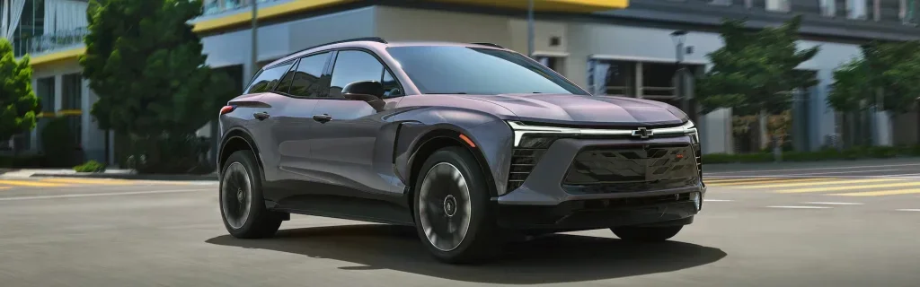 Chevrolet Equinox EV electric SUV in motion, showcasing contemporary design and everyday urban versatility.