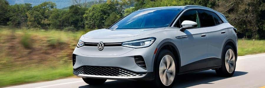 VW ID4 Pro S Grey driving outside by greenery
