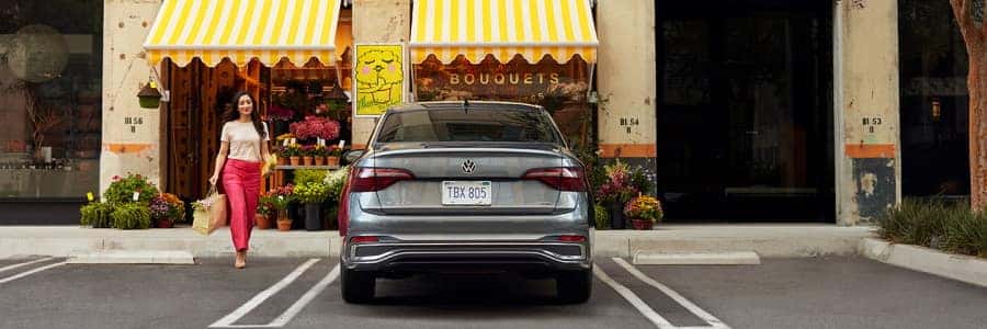 2022 VW Jetta parked in front of flower store