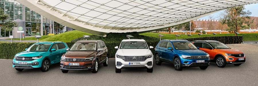 row of cars at a volkswagen dealership