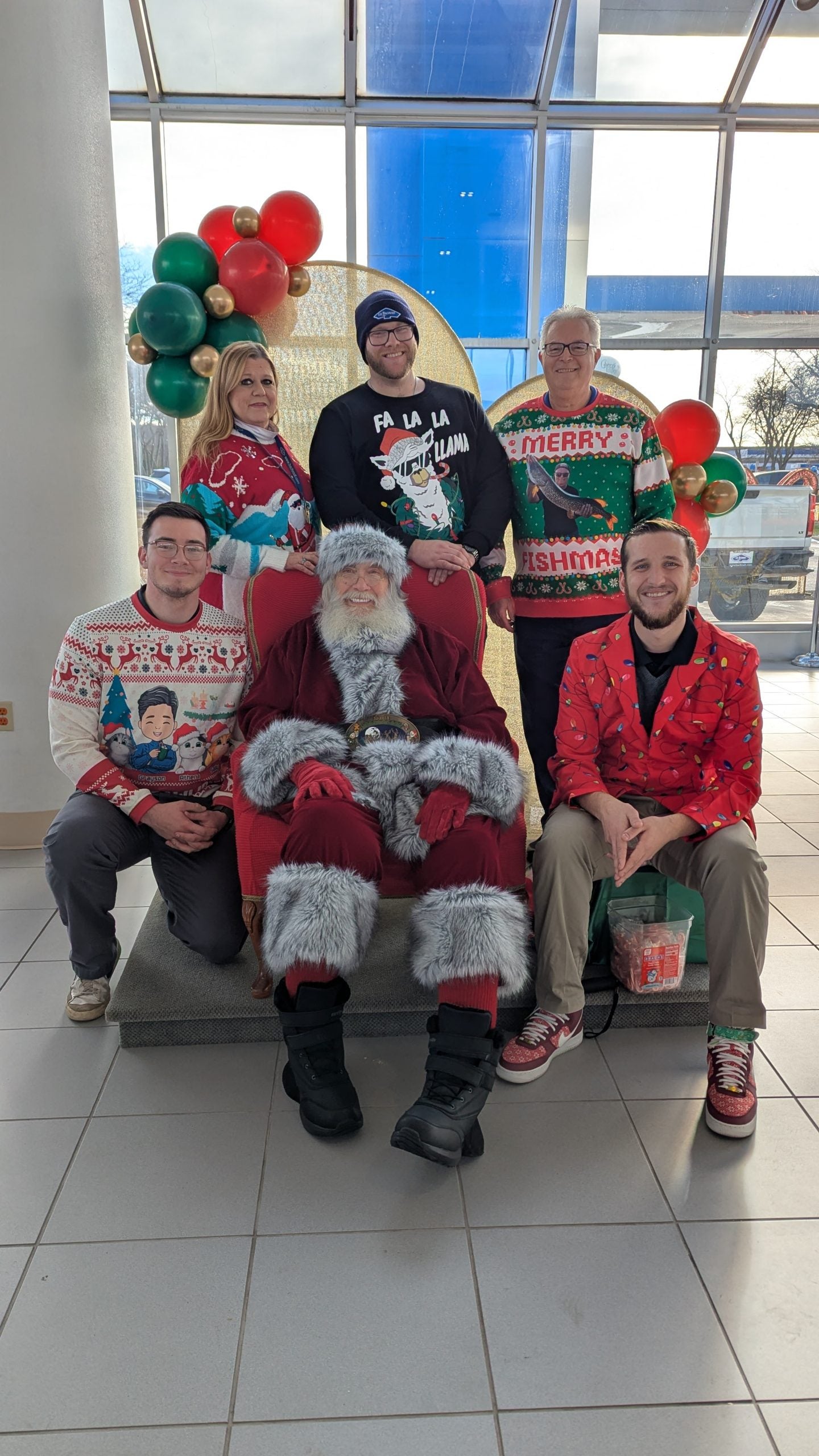 A group of Bachrodt On State employees sitting with Santa