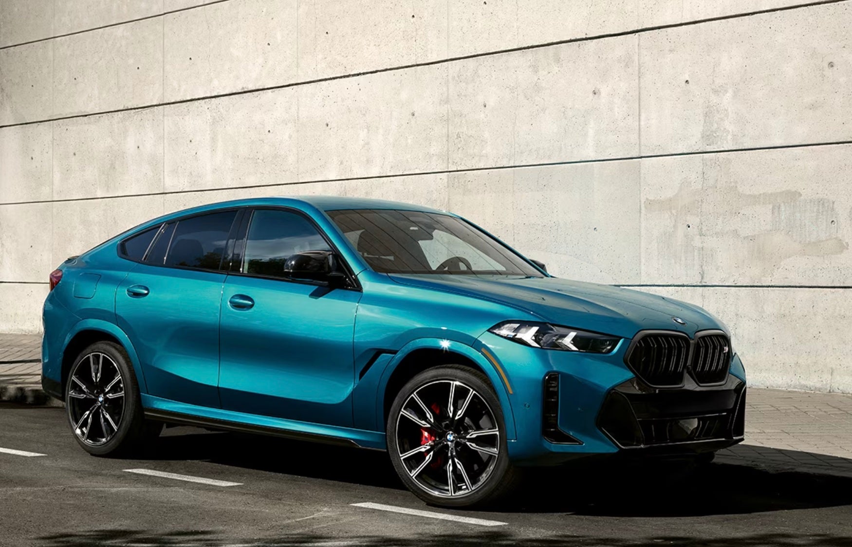 2024 BMW X6 parked inside a parking garage in Rockford.