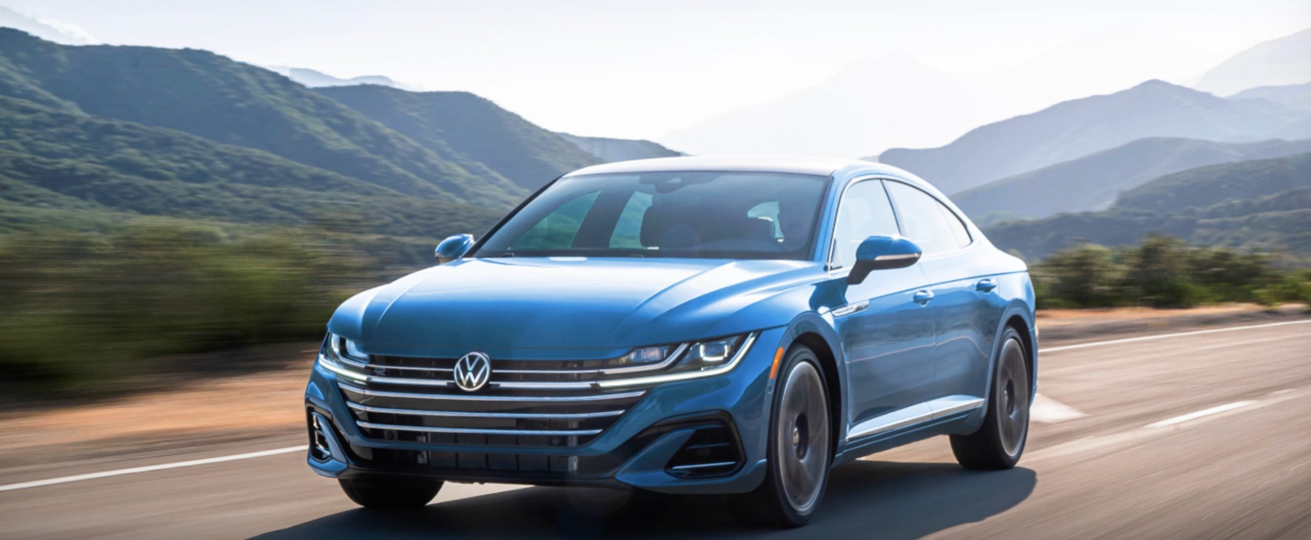 2023 Volkwagen Arteon from Lou Bachrodt Volkwagen in Rockford driving on the open road.
