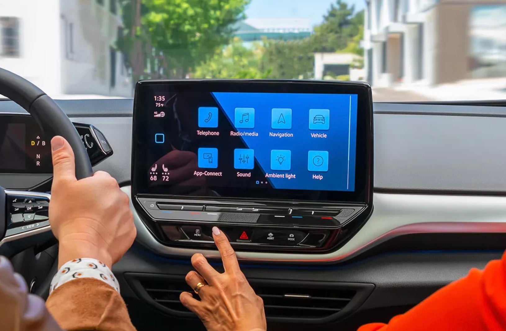 Volkswagen navigation system being used by the man and woman inside the vehicle.