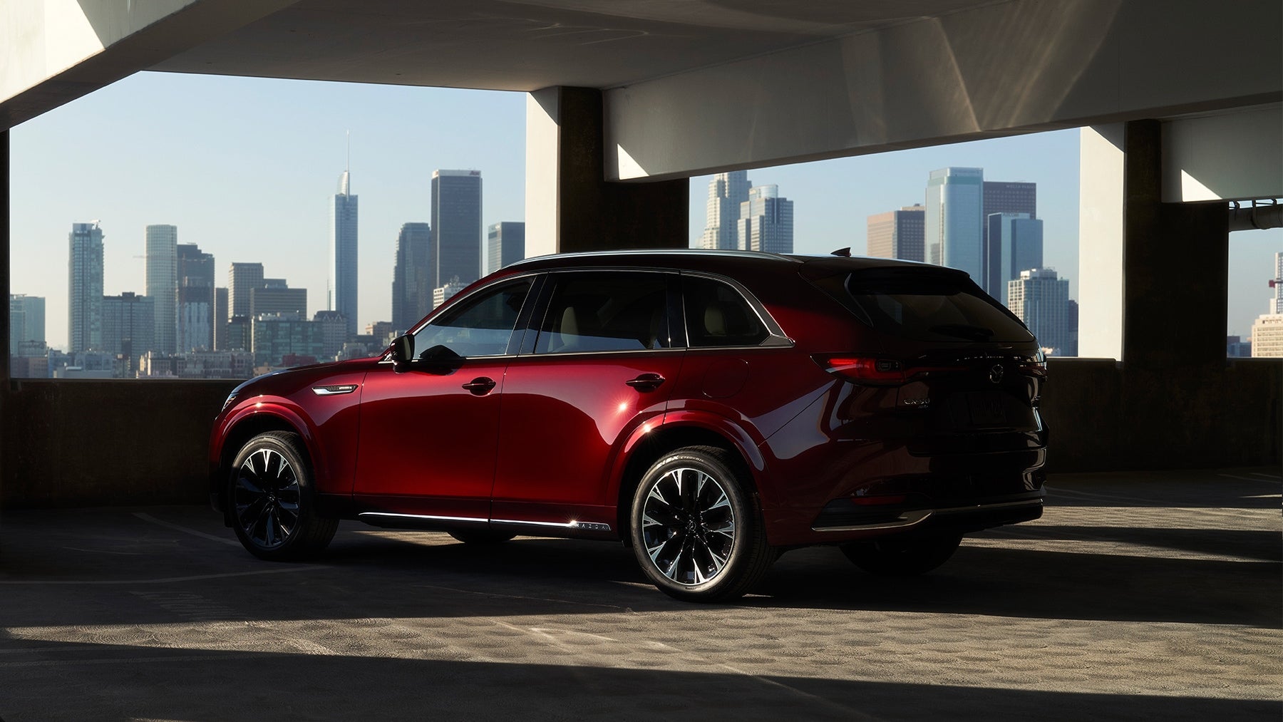 A red SUV meeting the Mazda Certified Pre-Owned requirements