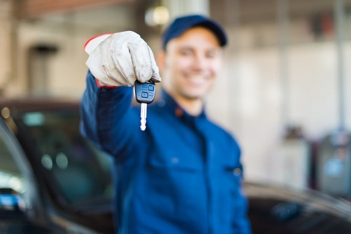 Mechanic giving you the car keys