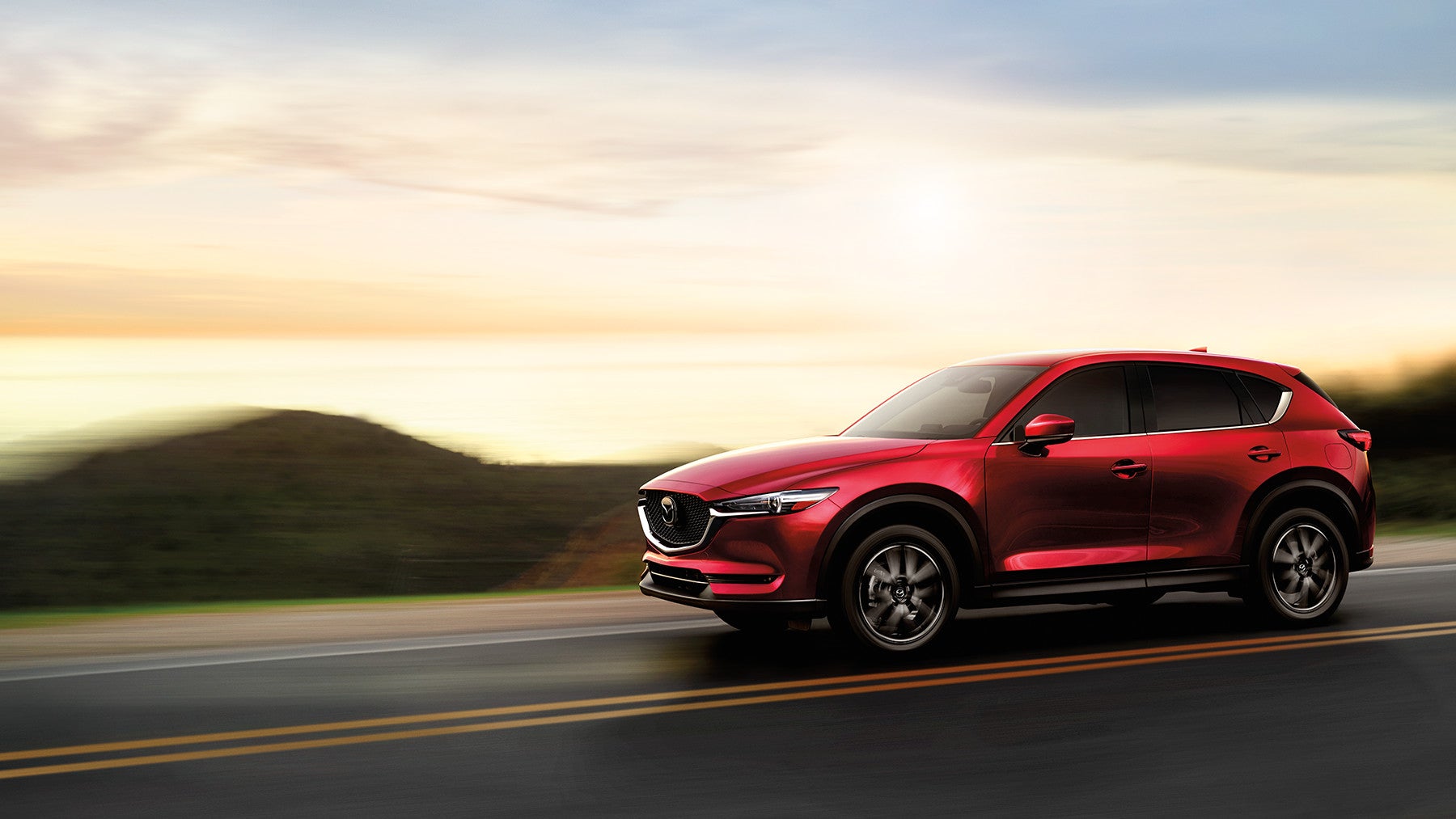 2017-cx5-new-soul-red-crystal-quarter-profile-beach-driving-mde-cx5-gallery