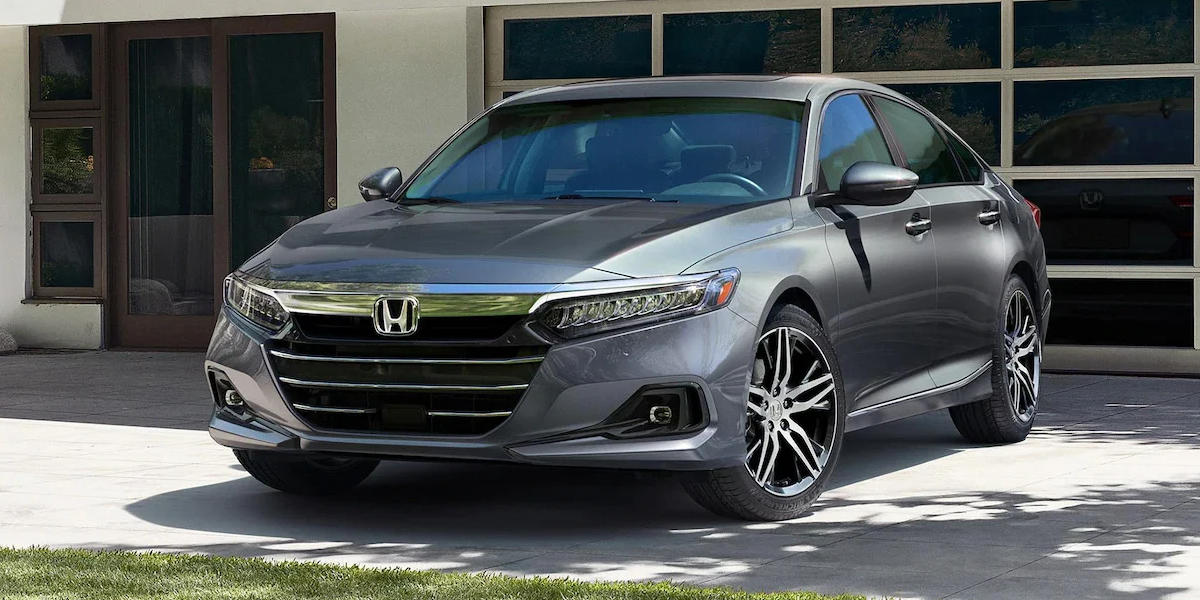 The 2021 Honda Accord parked outside an urban home
