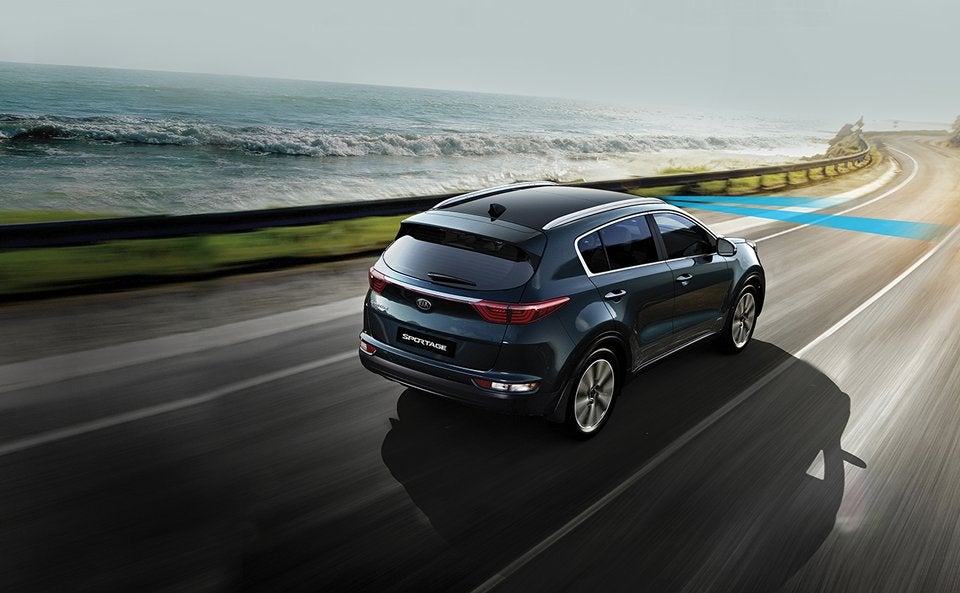 2017 Kia Sportage SUV driving down a highway