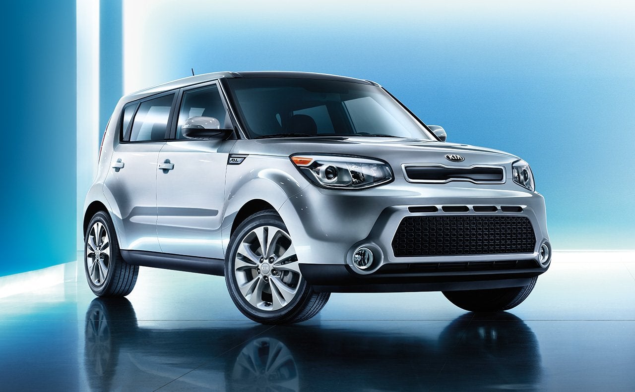 Bright silver Kia Soul in showroom