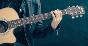 Musician playing an acoustic guitar