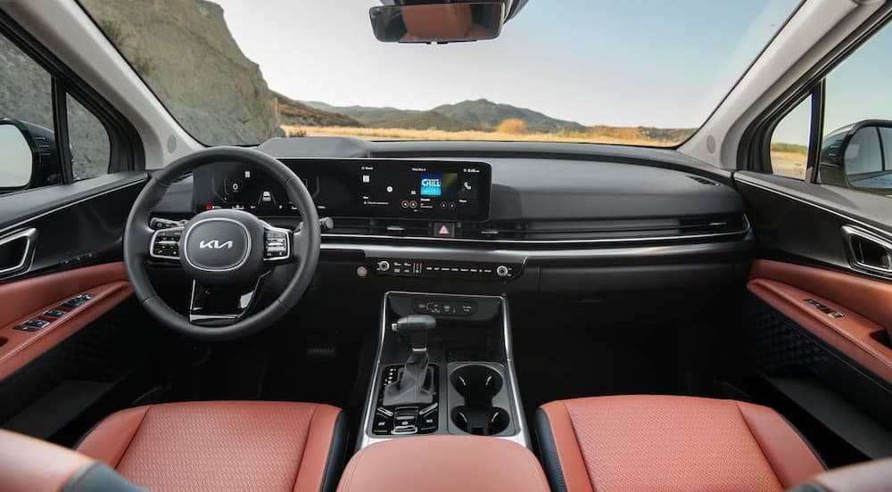 Black and brown interior and dash in a 2026 Kia Carnival.