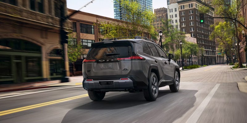 The 2026 Toyota RAV4 Hybrid using its fuel efficiency to drive down roads in St. Louis, MO
