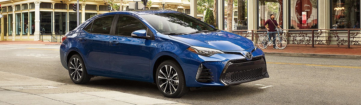 A blue 2019 Toyota Corolla paarked on the street