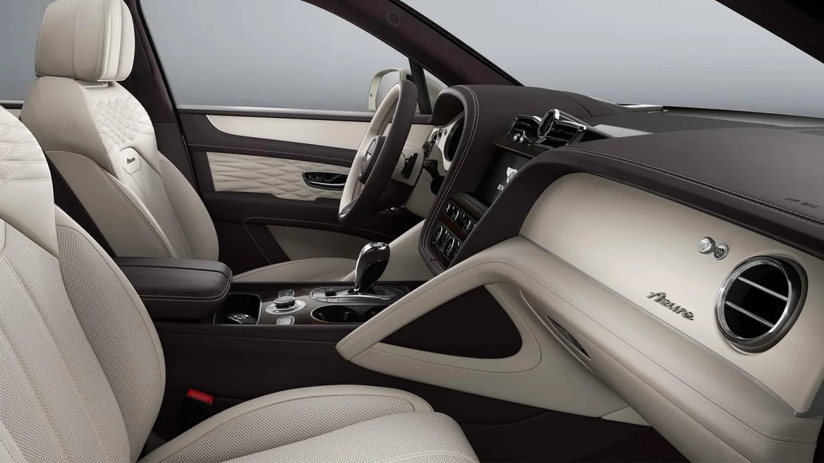 Current Bentley Bentayga Azure front cabin with light leather and Azure fascia badge