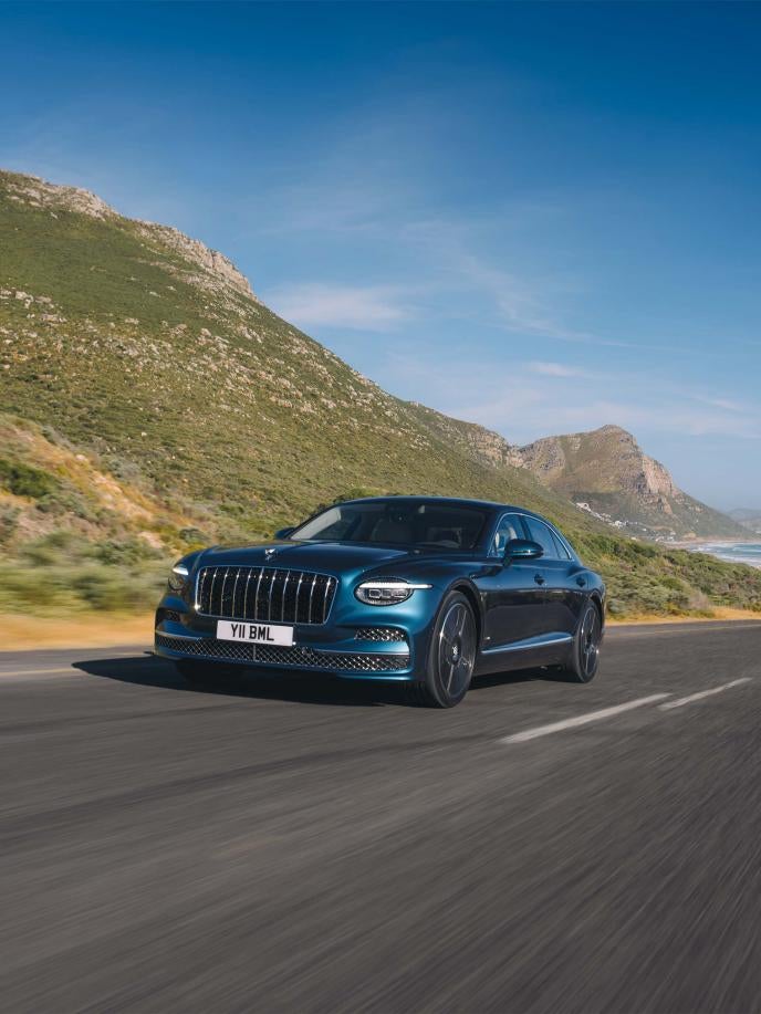 Bentley Flying Spur Azure in Dark Teal on a mountain road