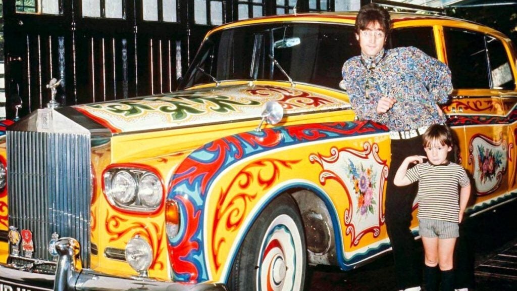 John Lennon next to his customize Rolls-Royce Phantom