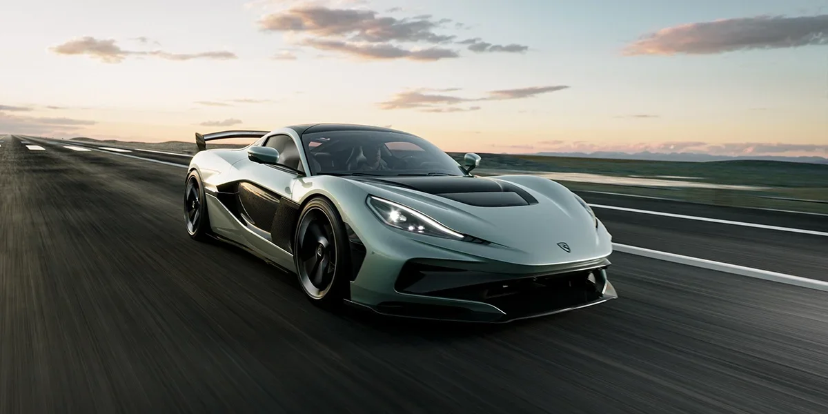 Mint-green Rimac Nevera R on an open road.
