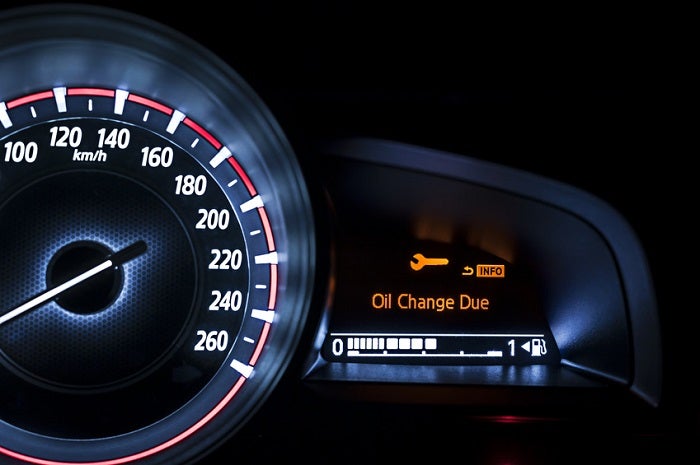 Lit-up dashboard signaling time for a Nissan service appointment