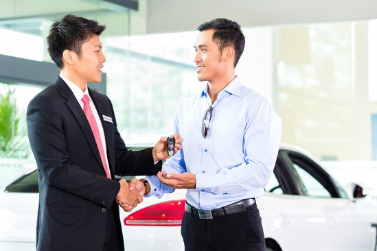 People at car dealership