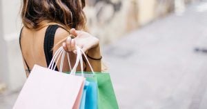Woman holding shopping bags | Gunther Kia