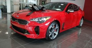 Red 2018 Kia Stinger with a big black bow on top | Gunther Kia