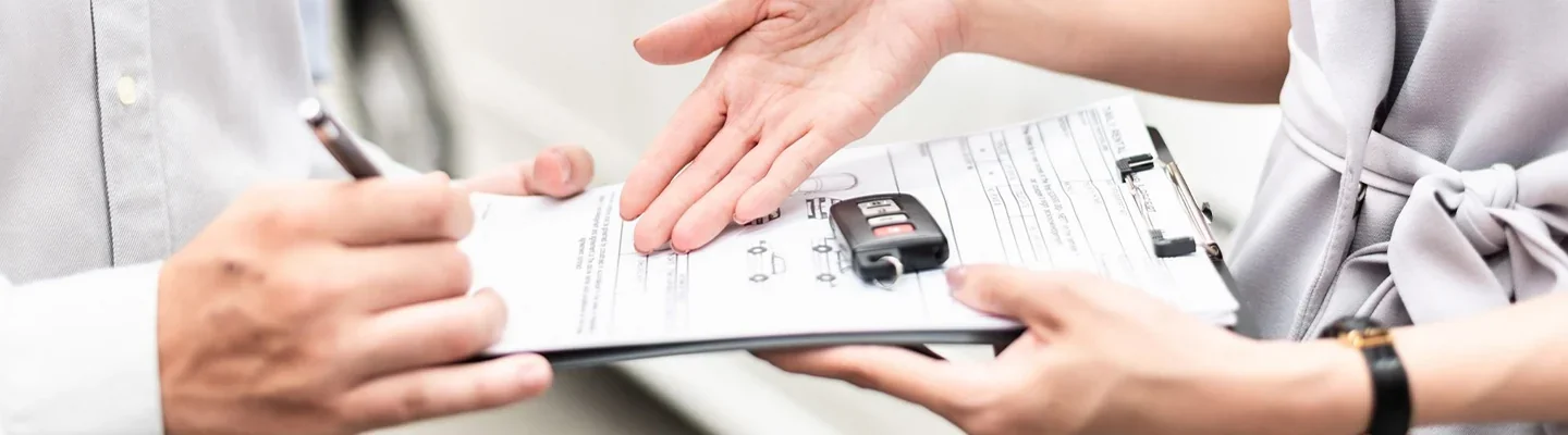 hands over a contract passing pens