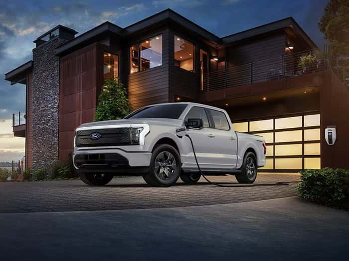 Gray Ford F-150 Lightning being charged