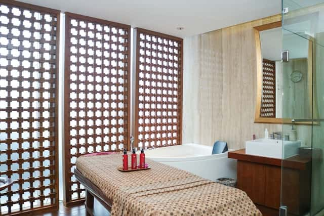 A spa room with a spa bed and shower