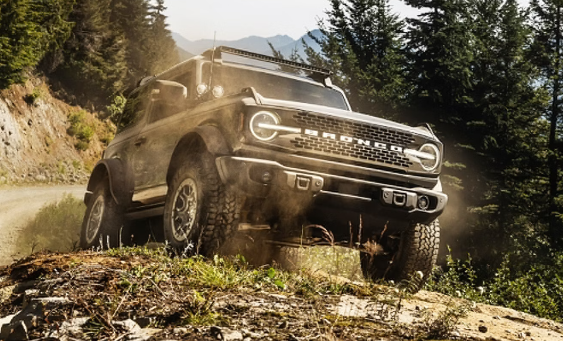 Ford SUV driving off-road