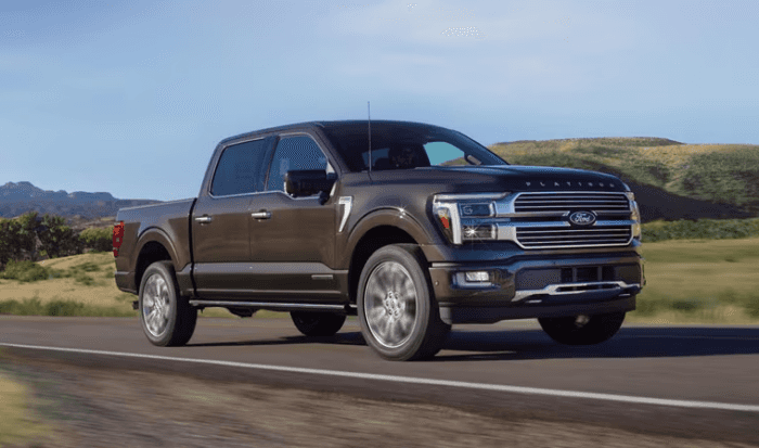 Brown 2025 Ford F-150 Platinum driving on road