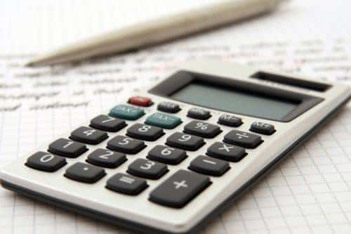 Calculator on contract with pen