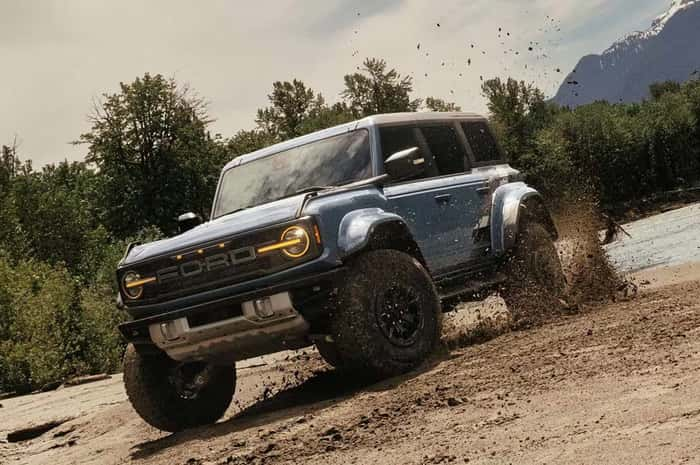 Ford Bronco driving in the mud